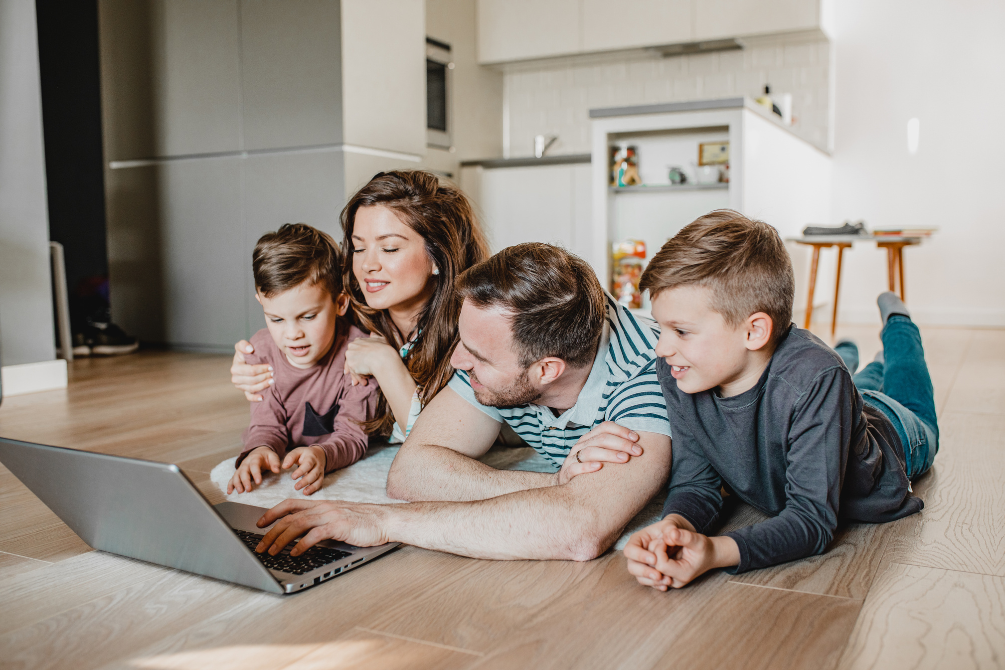 Modern tech family using laptop